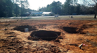 Holes and hardware installed for the three flag poles in the Flag Plaza