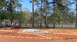 Workers installing forms for the concrete of the Flag Plaza