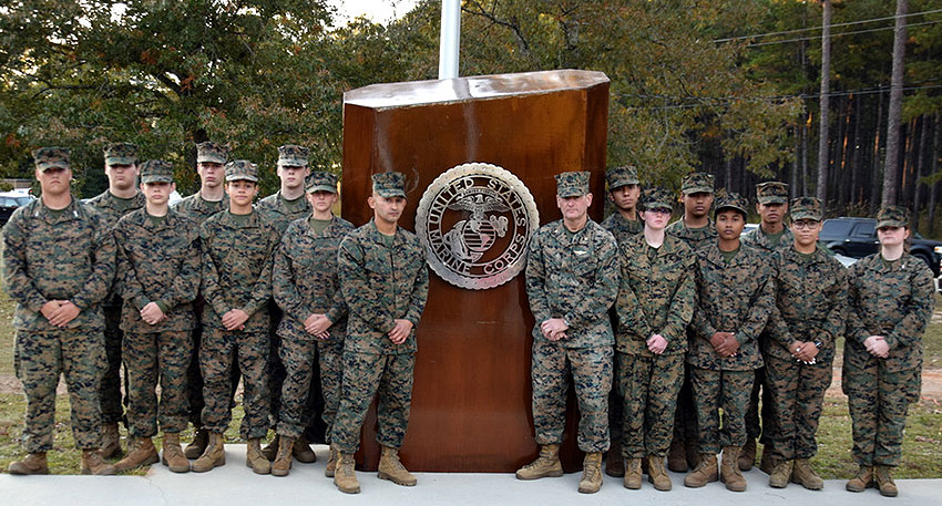 Marine Corp Service Members Standing by the branch monument.